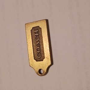 Coach key chain metal gold color